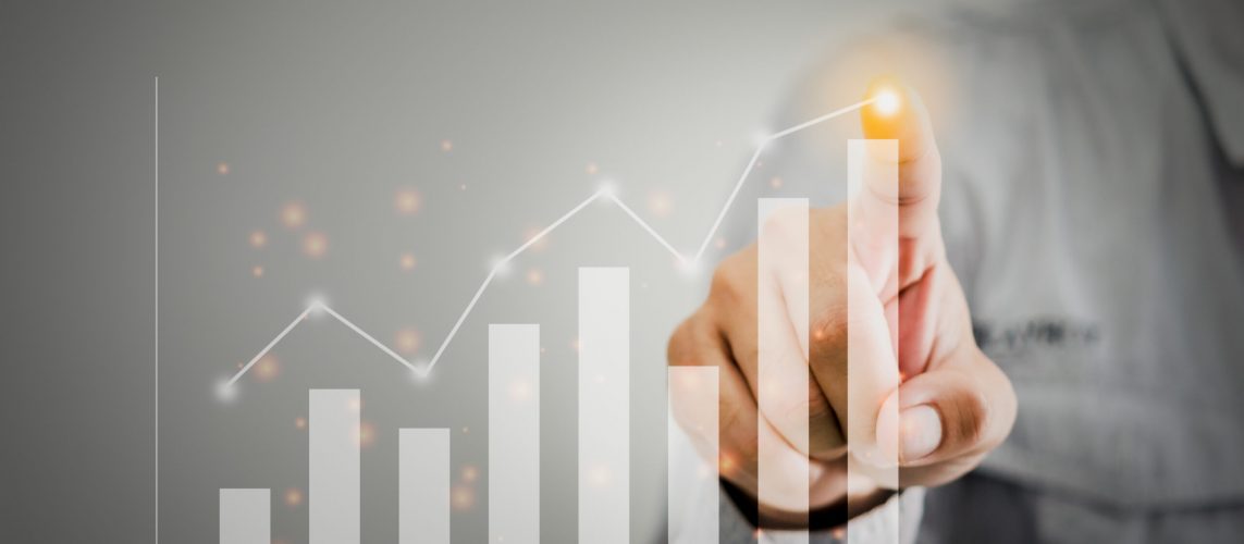 Businessman present a graph of profit growth and chart.Hands are touching financial graph plan